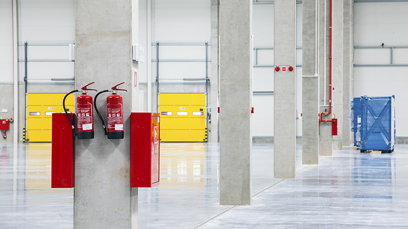 Fire Extinguishers Mounted in Warehouse